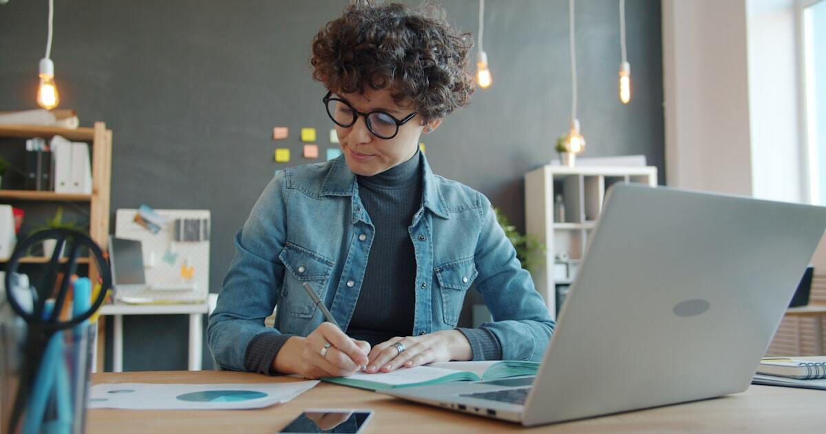 Business owner reviewing marketing analytics at desk
