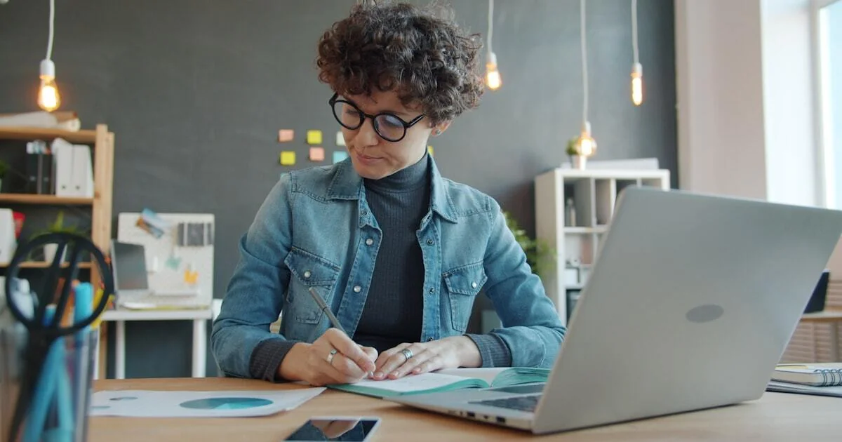 Business owner reviewing marketing analytics at desk
