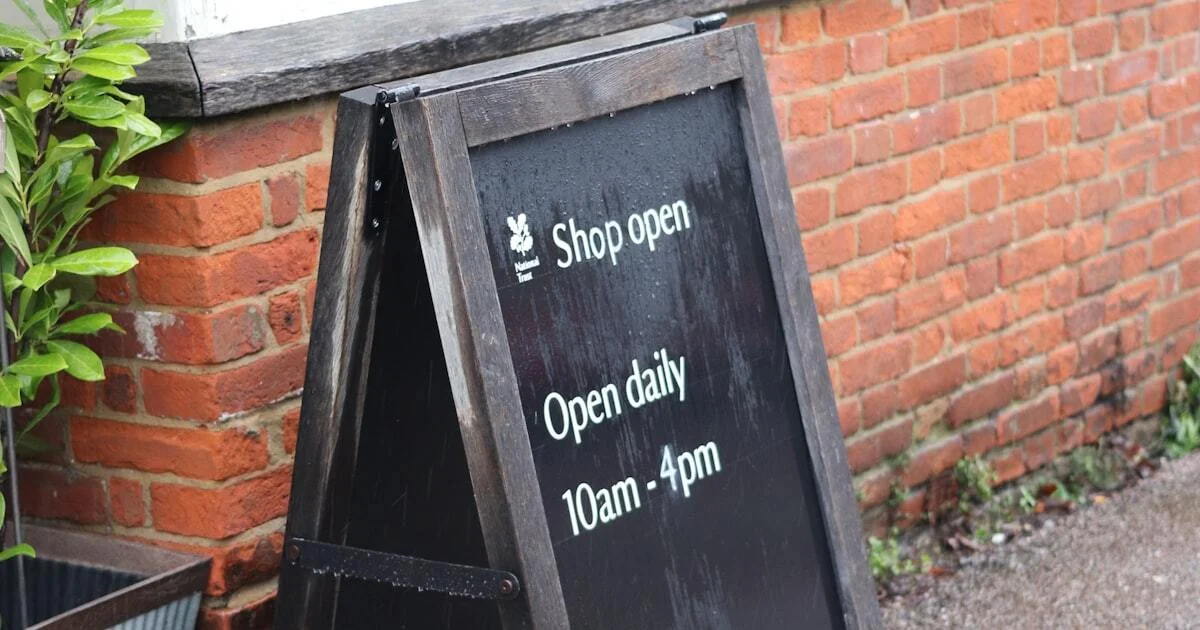 Local business storefront with open sign