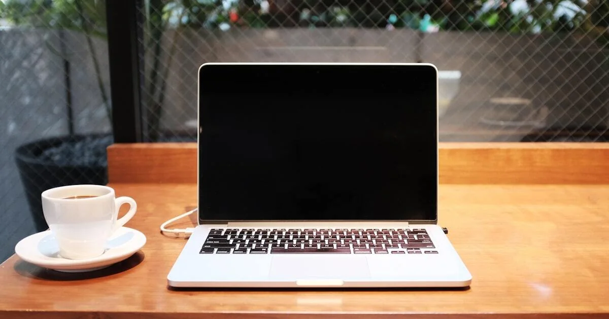 Small business owner reviewing Google Ads performance on laptop